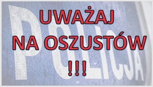baner z napisem ,,uważaj na oszustów". w tle widoczny napis policja