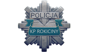 gwiazda, odznaka policyjna z napisem w górnej części policja a poniżej kp rokiciny