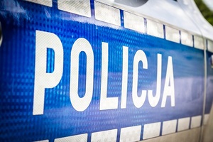 Baner z napisem Policja